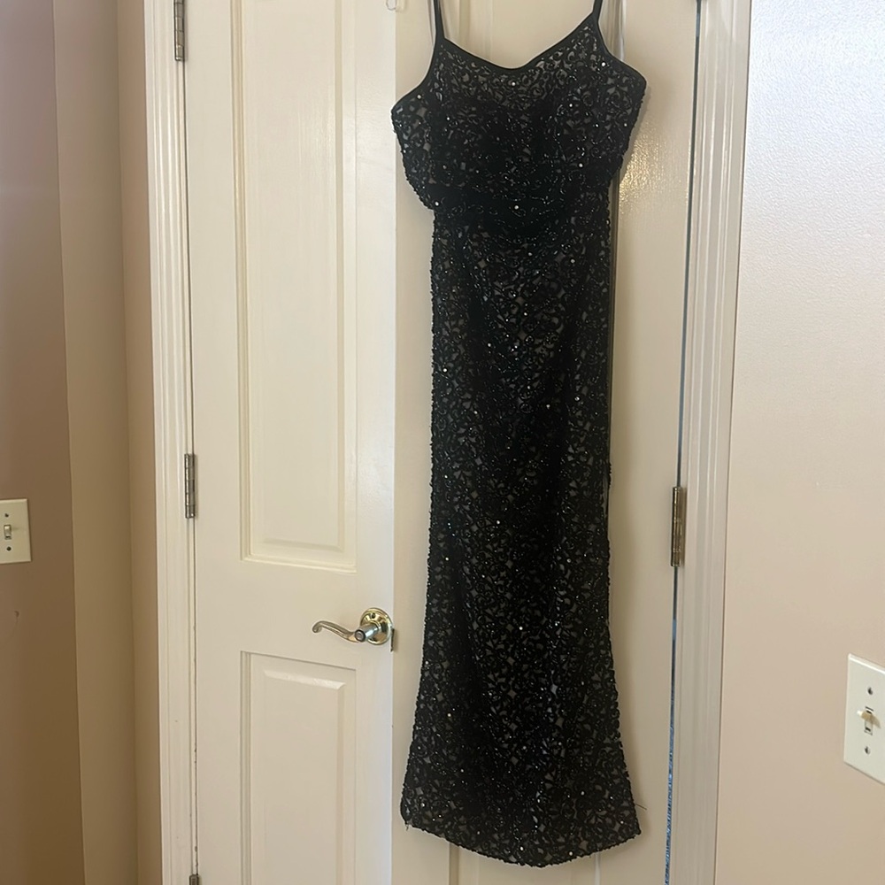 Claire’s Collection couture long black sequin gown.